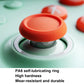 Wireless gaming controller thumbstick detail with textured orange ring on mint base