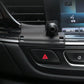 Phone navigation bracket base mounted on car dashboard near hazard button