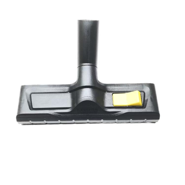 Floor cleaning brush attachment with yellow push-button on gray base