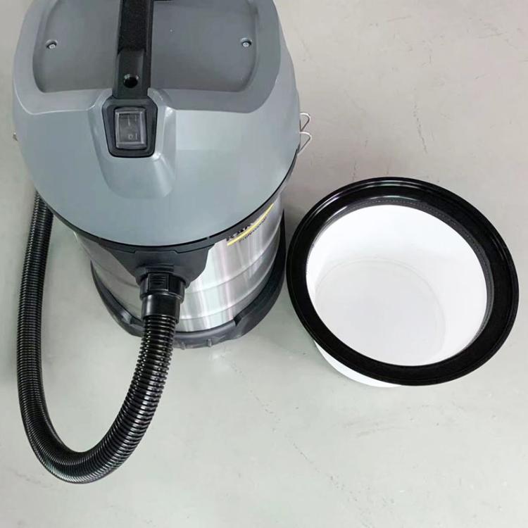 Vacuum canister dust compartment filter installed, black rim and white media