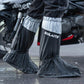 Black and silver waterproof shoe covers on boots, anti-slip soles for wet weather