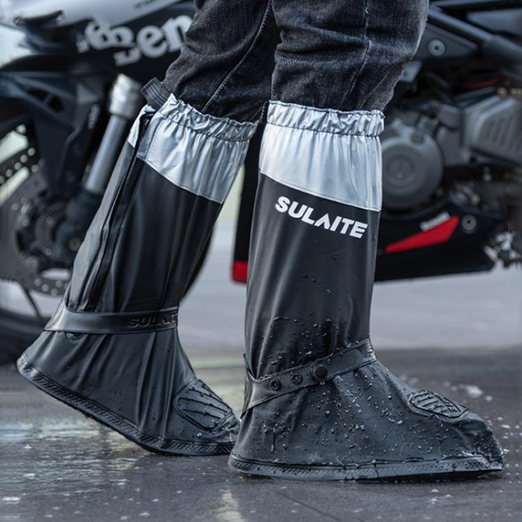Black and silver waterproof shoe covers on boots, anti-slip soles for wet weather