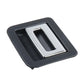 Dark plastic trunk puller/buckle insert with silver metal center opening