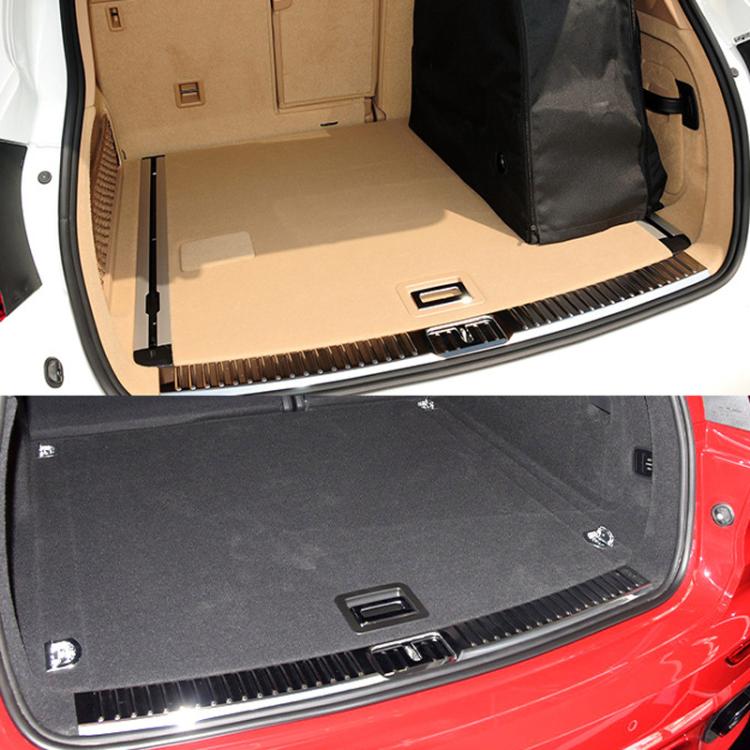 Beige trunk puller/buckle insert on car trunk carpet mat