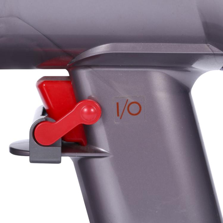 Vacuum handle switch latch retainer with red lever on gray body near I/O