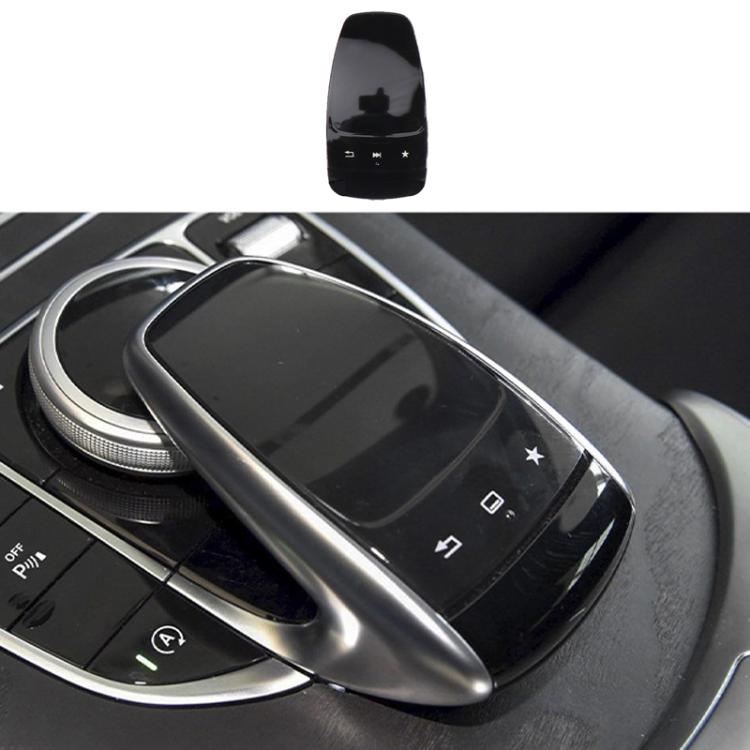 Installed glossy black car multimedia mouse cover on center console controller