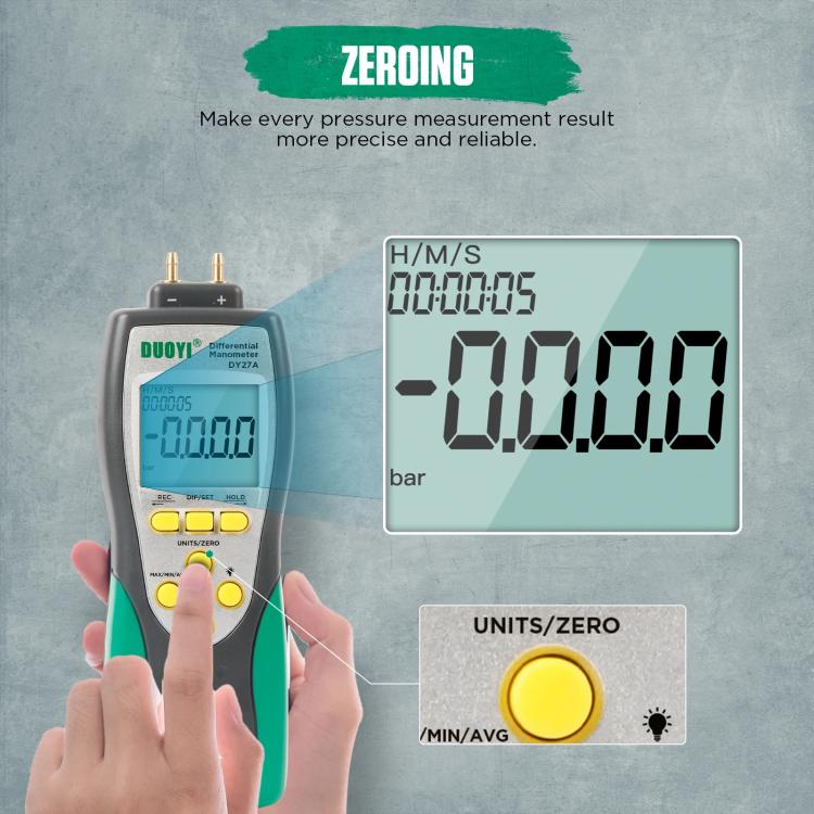 Digital differential pressure gauge held in hands with LCD screen and yellow unit/zero button
