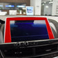 Red carbon-fiber style center console screen sticker with curved bezel trim