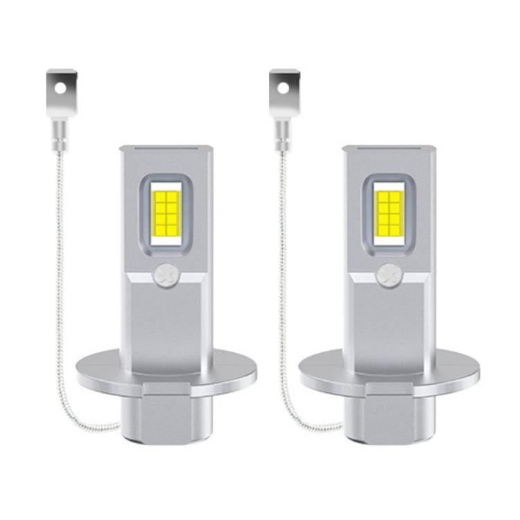 Pair of silver LED headlight bulbs with yellow COB chips, gray socket, and wire leads