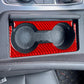 Red carbon-fiber gear shift cup holder trim with two circular openings installed