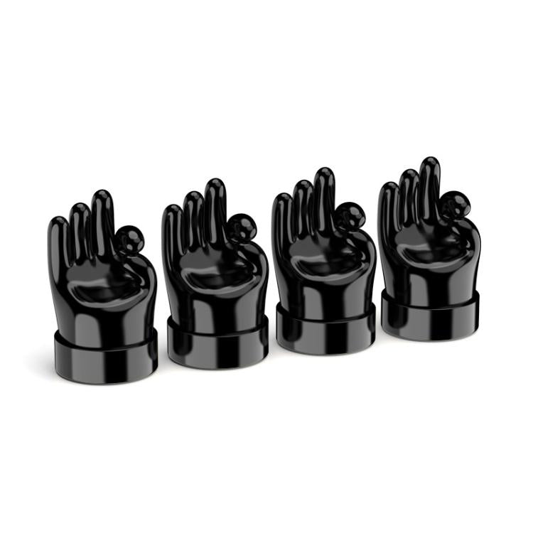 Set of 4 black hand-shaped tire valve caps with raised finger gestures