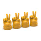 Set of 4 yellow hand-shaped tire valve caps with raised finger gestures