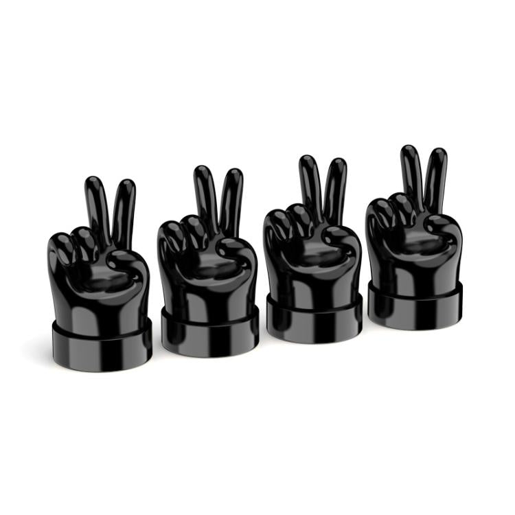 Set of 4 black hand-shaped tire valve caps with raised finger gestures