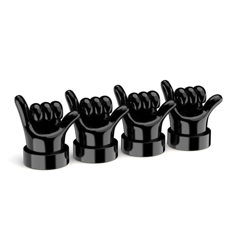 Set of 4 black hand-shaped tire valve caps with raised finger gestures