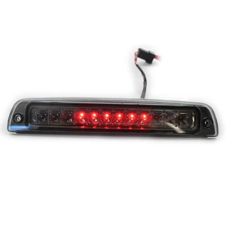 LED third brake light with red LEDs lit through smoked lens, high-mounted