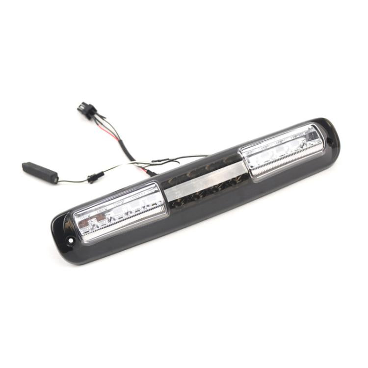 LED high mount brake light with clear reflectors and black housing