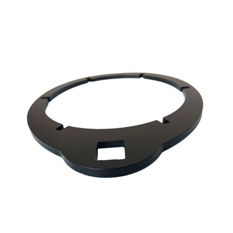 Fuel filter wrench ring tool, dark circular body with side notches