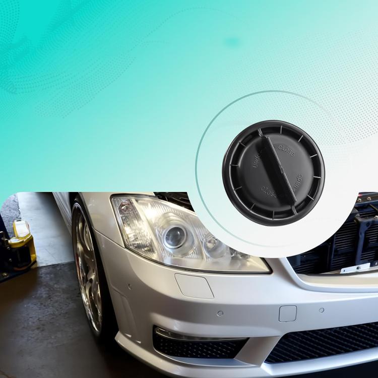 Headlight dust cover on Mercedes-Benz headlamp area, black round protective cap