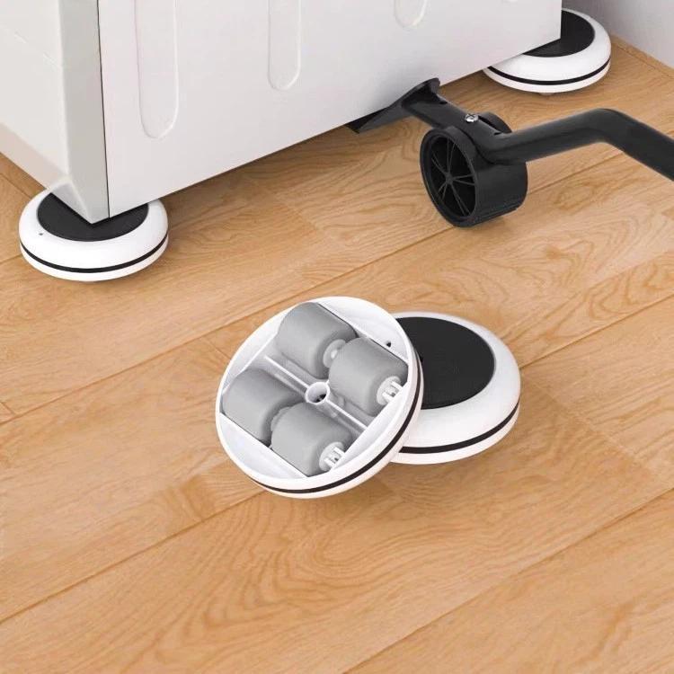 Furniture mover roller with white circular base and black corner wheels on wood floor
