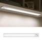 White-lit silver motion-sensor light bar under cabinet with side sensor window