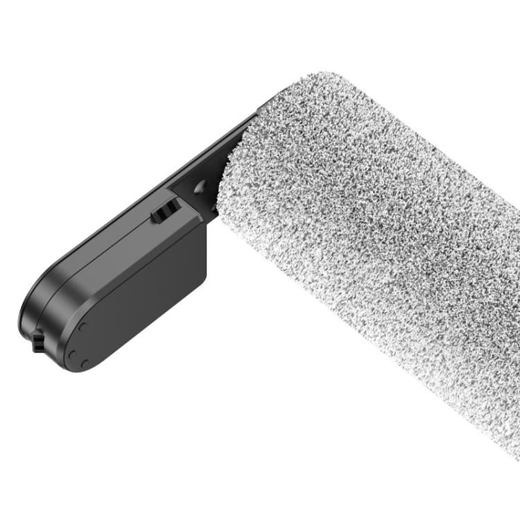 Grey floor roller brush with black housing and textured cleaning surface