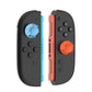 Pair of side views of controller grips with installed silicone joystick caps in blue and orange