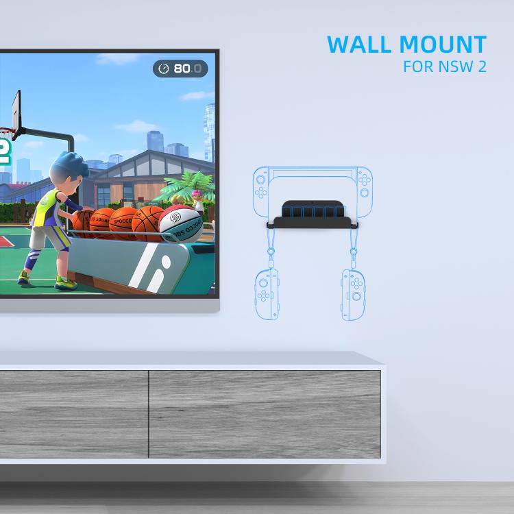 Black wall mount holder mounted under a TV, showing game card storage tray
