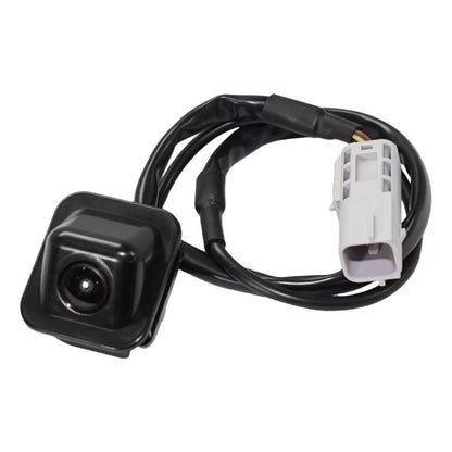 Reversing parking assist camera with black housing, lens, and white wiring connector