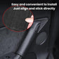 Dark gray faux leather interior door handle cover being installed over handle