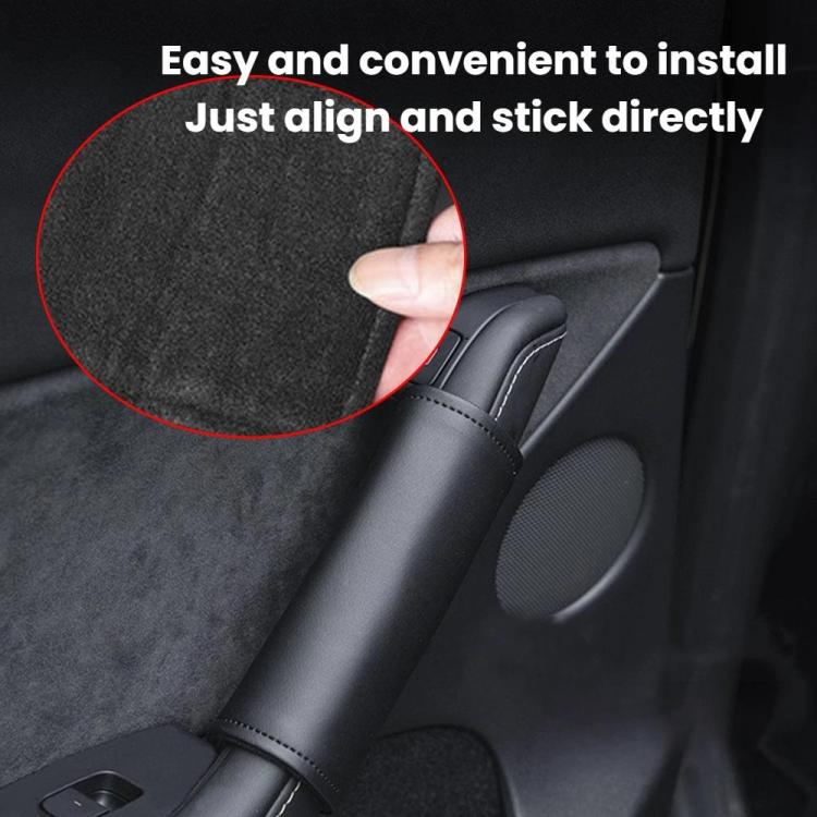 Dark gray faux leather interior door handle cover being installed over handle