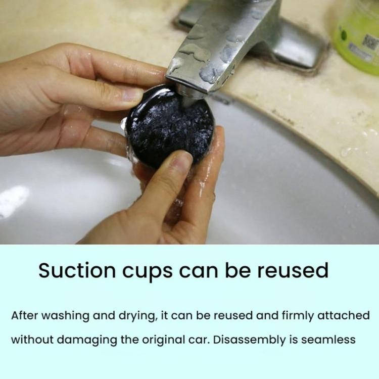 Hands pressing reusable suction cup ball onto a car roof panel