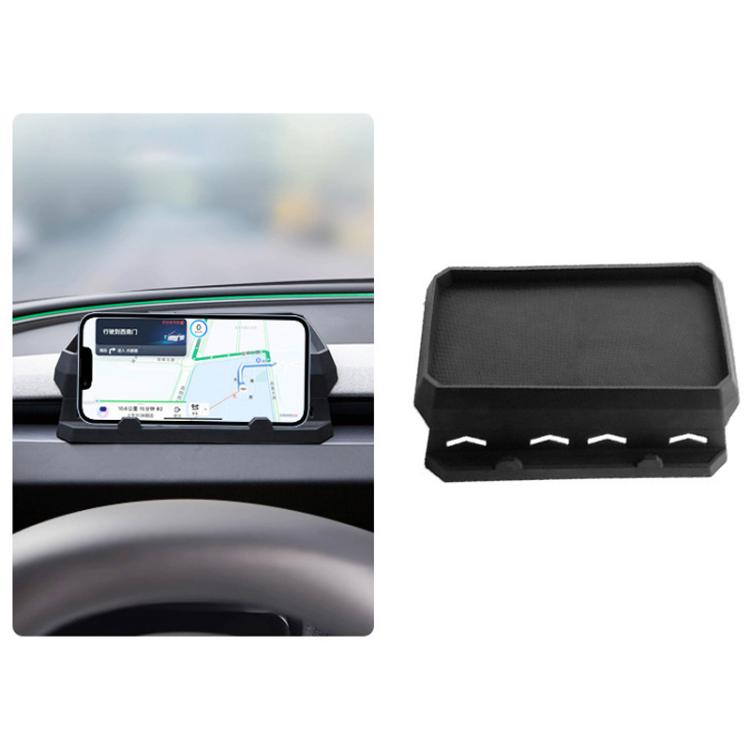Dashboard tissue tray with raised edges and front storage cutouts