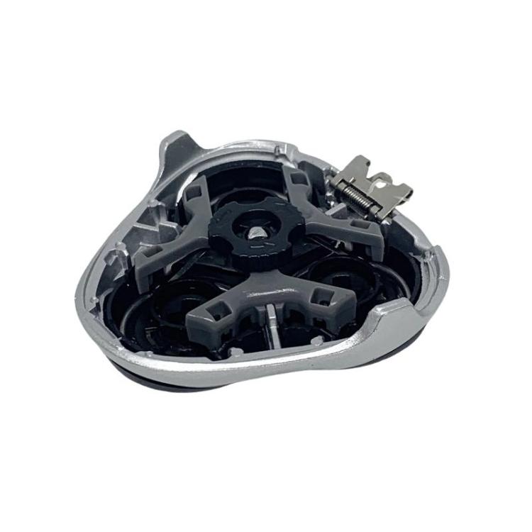 Replacement shaver head open view showing internal cutter parts and mount components