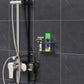 Wall-mounted black acrylic storage stand with razor slots in a bathroom