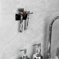 Self-adhesive razor storage holder holding multiple razors on a bathroom wall