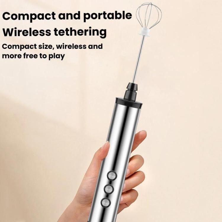 Portable wireless handheld milk frother in hand, stainless steel casing