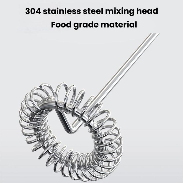 Stainless steel mixing whisk for electric milk frother, tightly coiled.