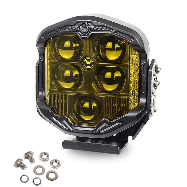 7-inch LED work light with yellow lens, rugged black housing, and side mounting nuts
