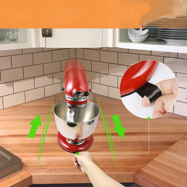 Black non-slip blender mat under mixer base, hand adjusting mat