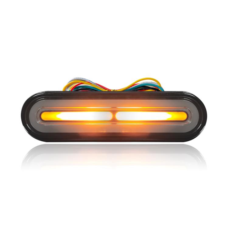 LED brake tail light with amber glow bar in black oval housing