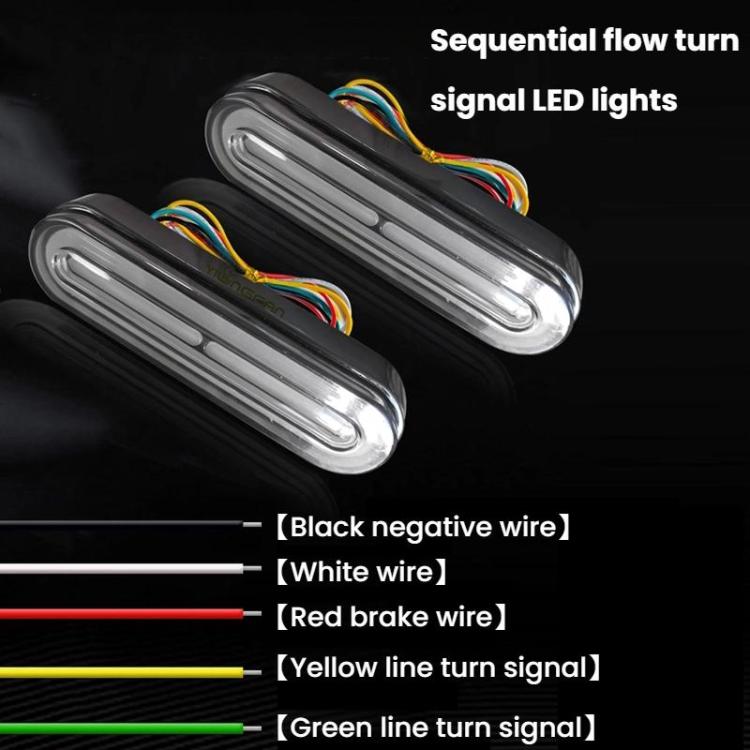 LED tail light with smoked lens and color-coded wire leads for turn signals
