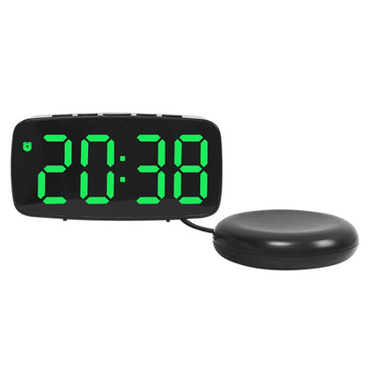 Black LED alarm clock with green light time display and round vibration base.