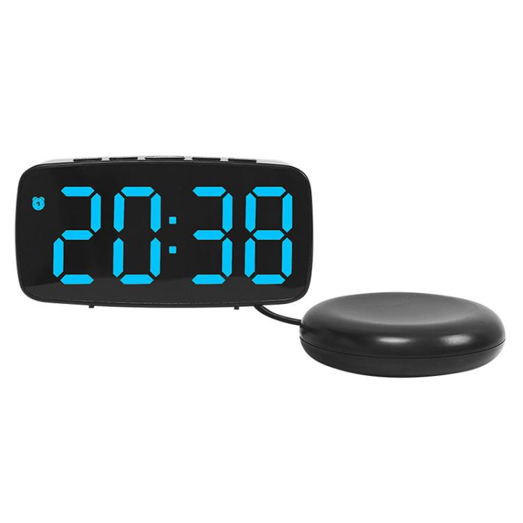 Black LED alarm clock with blue light time display and round vibration base.