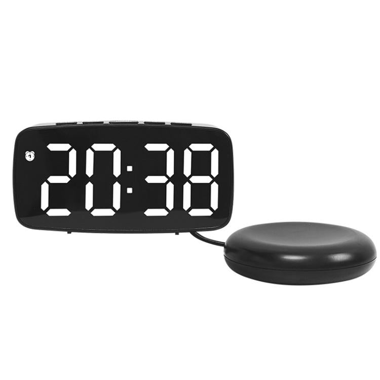 Black LED alarm clock with white light time display and round vibration base.