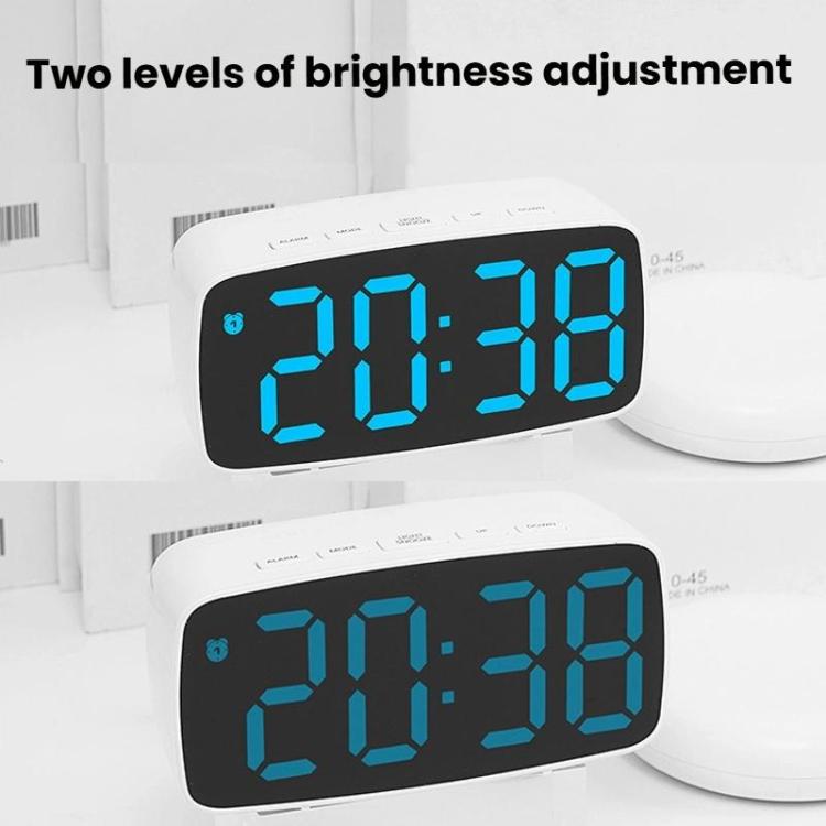 Two white LED alarm clocks showing blue time digits, stacked for brightness levels.