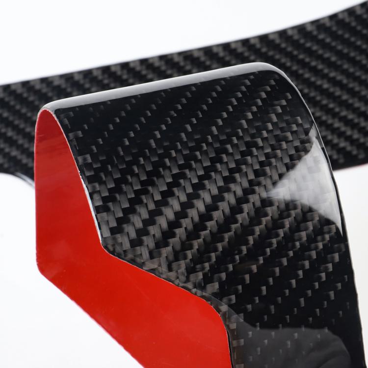 Red and black carbon-fiber side tunnel protection sticker close-up detail