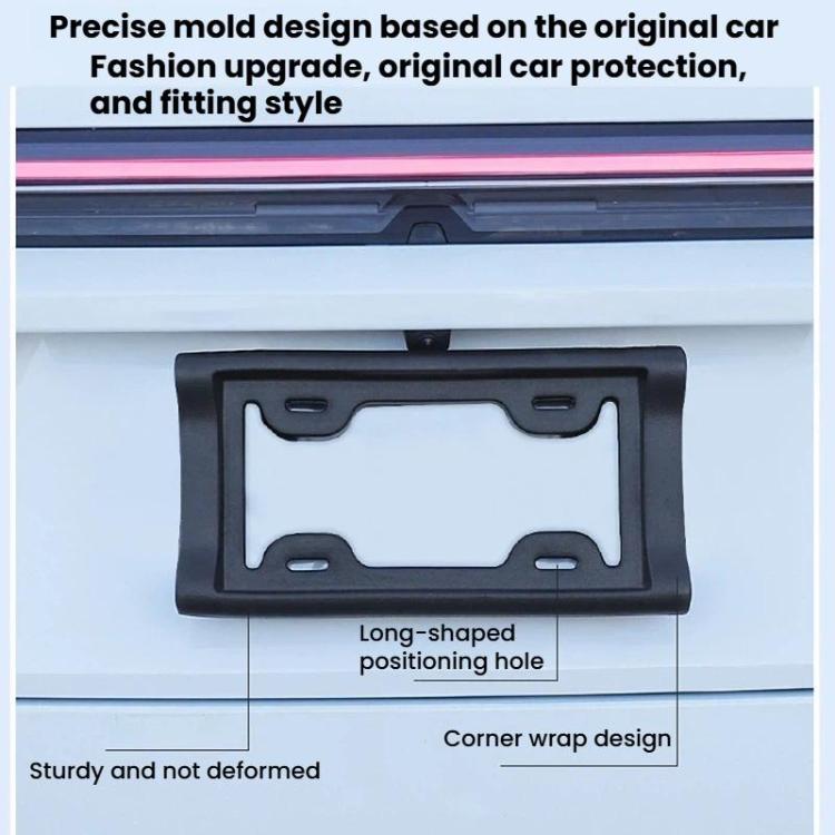 Black US license plate frame holder on car grille area with long mounting holes