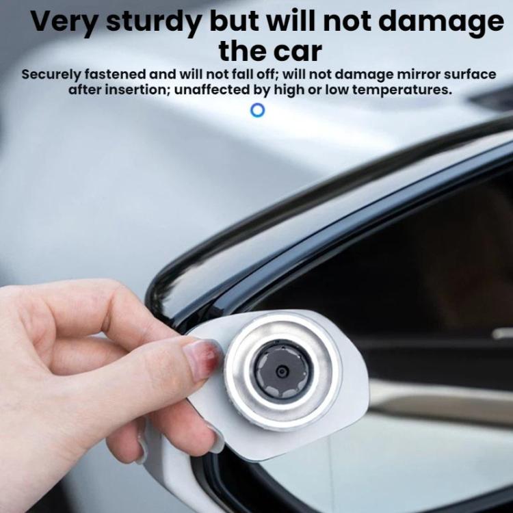 Suction cup blind spot assist mirror with silver mount, held against a car window
