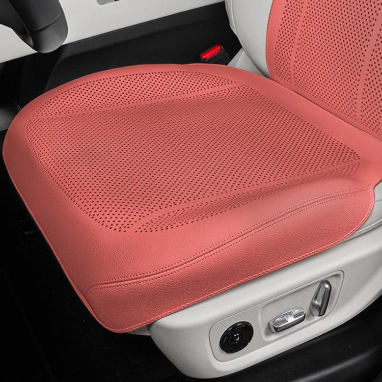 Red perforated front car seat cushion with breathable ventilation holes.
