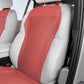Red perforated backrest car seat cushion cover with breathable ventilation holes.